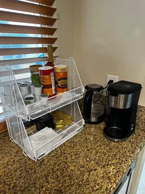 a wire basket sitting on a counter with food at Buxton Mirror Room in Rialto