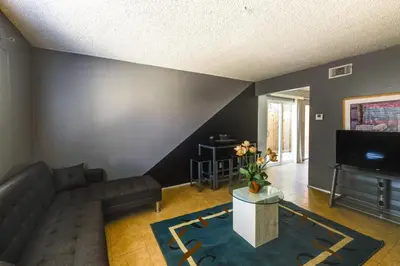 a living room with a couch and a tv at 3 Mi to Universal Studios North Hollywood Home in North Hollywood