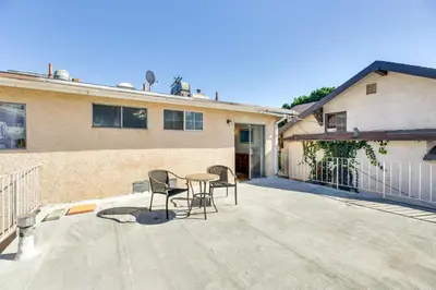 a patio with a table and chairs in front of a building at 3 Mi to Universal Studios North Hollywood Home in North Hollywood