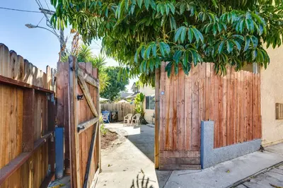 a pair of wooden gates in a yard at 3 Mi to Universal Studios North Hollywood Home in North Hollywood