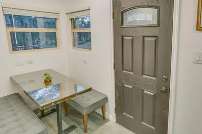 a room with a desk and a door and a chair at Cozy Wrightwood Cabin Family and Pet Friendly! in Wrightwood