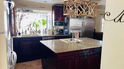 a kitchen with a sink and a refrigerator at Private Room View Gated 2Acre Estate - Female Share Indoor - Men Share Outdoor - SD in Encino