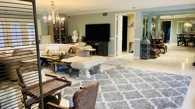 a living room with a couch and a table at Private Room View Gated 2Acre Estate - Female Share Indoor - Men Share Outdoor - SD in Encino