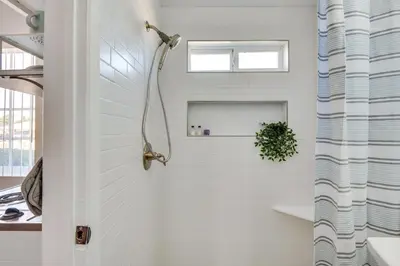 a shower in a bathroom with a white wall at Cozy Simi Valley Studio Less Than 10 Mi to Hiking and Golf in Simi Valley