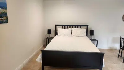 a bedroom with a large bed with two night stands at Holiday at Halliday in Los Angeles