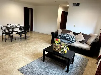 a living room with a couch and a table at Holiday at Halliday in Los Angeles