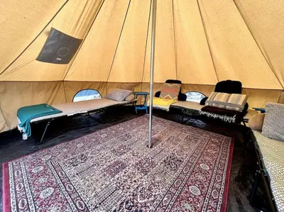 a large tent with a rug in the middle of it at Peaceful 1BR Suite, Yurt and Barn in Cypress Park in Glendale