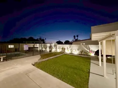 a house with a lawn in the yard at night at Disneyland Retreat-Pool Spa Game in Anaheim