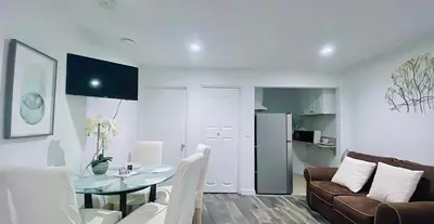 a living room with a couch and a table at Lovely Sherman Oaks Studio in Los Angeles
