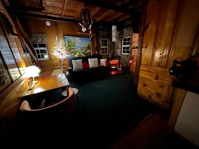a living room with a couch and a table at 1 B1B lake cabin/walk to lake/Boulder bay park in Big Bear Lake