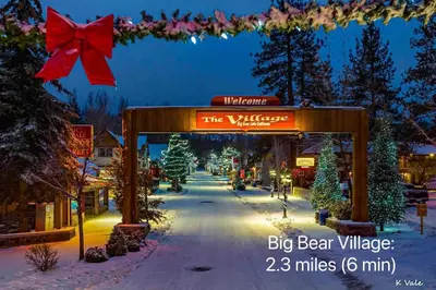 a sign for the village of big bear village with christmas trees at 1 B1B lake cabin/walk to lake/Boulder bay park in Big Bear Lake