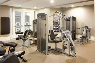 a gym with several exercise equipment in a room at Blue Topaz Retreat - Spacious 3BR Gorgeous City views in Los Angeles