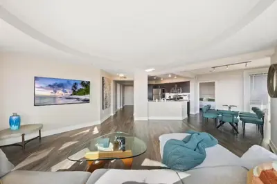 a living room with a couch and a table at Blue Topaz Retreat - Spacious 3BR Gorgeous City views in Los Angeles