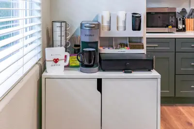 a kitchen with a counter with appliances on it at Charming Disneyland Retreat - Sleeps up to 12 w Game Room, Pool Table, EV w King Bed in Midway City