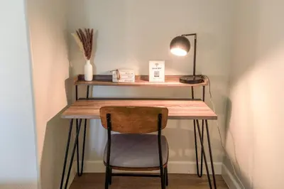 a desk in a corner with a chair and a lamp at Cozy Luxe Unit Near Disneyland - Sleeps up to 10! EV Friendly & King Bed in Midway City