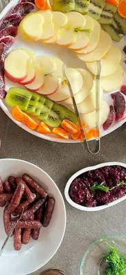 a table with three plates of food with different foods at Resort Getaway in Private Garden Terrace Villa w Luxury Amenities in Los Angeles