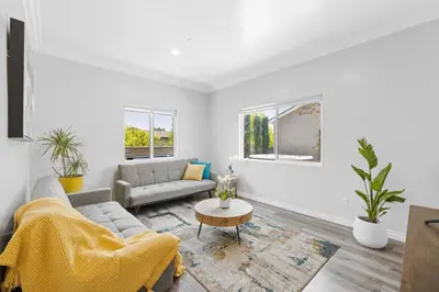 a living room with a couch and a table at Stylist Home In Convenient Location! in Temple City