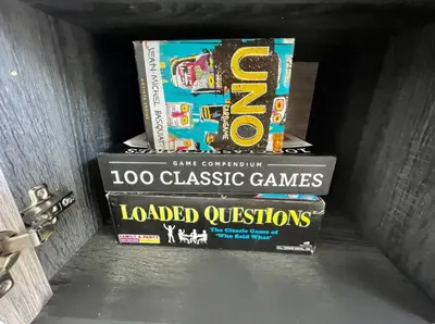 a stack of books stacked on top of each other at Stylist Home In Convenient Location! in Temple City