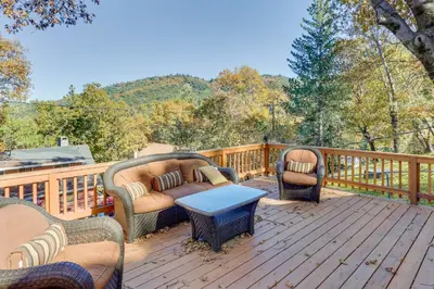 a deck with two chairs and a couch and a table at Spacious Crestline Retreat 1 Mi to Lake Gregory in Crestline