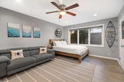 a living room with a couch and a bed at On the Boardwalk in Long Beach