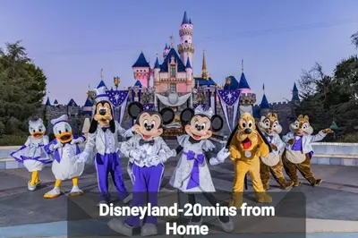a group of mascots standing in front of a castle at Amazing Value with High Comfort, 14 Guests for 4BR by Disneyland, Beaches, Rodeo 39 & More in Midway City
