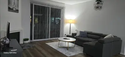 a living room with a couch and a table at Large two-room apartment near LAX and the Ocean in Los Angeles