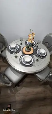 a dining table with plates and dishes on it at Large two-room apartment near LAX and the Ocean in Los Angeles