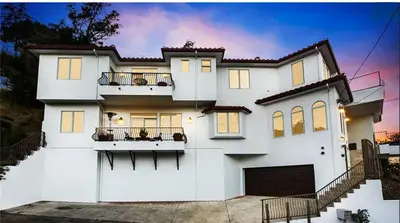 a white house with a lot of windows at Hills of Studio City, your serene home away from Home in Studio City