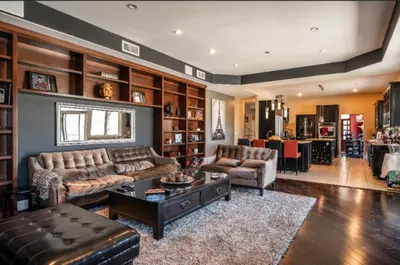 a living room with a couch and a table at Hills of Studio City, your serene home away from Home in Studio City