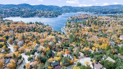 an aerial view of a town with a river and trees at Majestic Lakeview Lodge in Lake Arrowhead