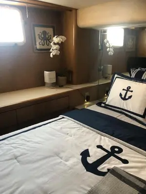 a bedroom with a bed with an anchor pillow at Luxury Afloat Yacht Paradise 3 bedrooms 3bath 5 beds with full Marina view in Los Angeles
