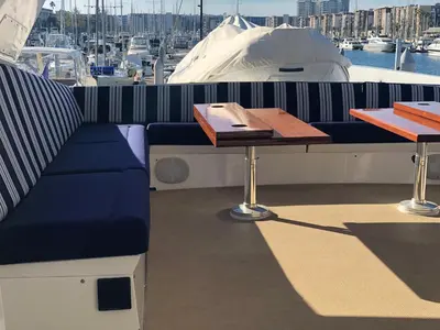 a table and a bench on a boat at Luxury Afloat Yacht Paradise 3 bedrooms 3bath 5 beds with full Marina view in Los Angeles
