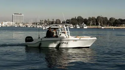 two people in a boat on the water at Luxury Afloat Yacht Paradise 3 bedrooms 3bath 5 beds with full Marina view in Los Angeles