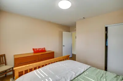 a bedroom with a bed and a dresser at Lakewood Home about 5 Mi to Knotts Berry Farm! in Lakewood