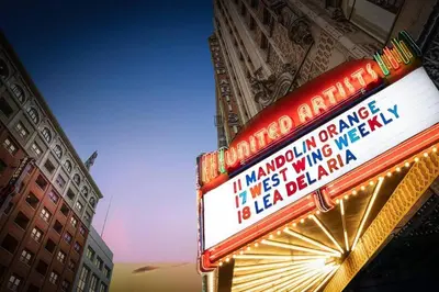 a sign for a theatre in front of a building at Modern Loft in DTLA - Rooftop Pool & Free Parking! in Los Angeles