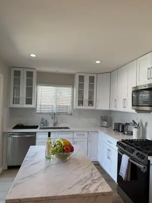a kitchen with a bowl of fruit on a counter at Coastal Escape in Redondo Beach in Redondo Beach