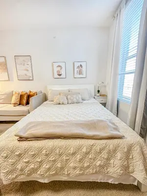 a white bedroom with a large bed and a couch at MDR Studio Apartment Luxury pool, gym, parking, jacuzzi. in Los Angeles