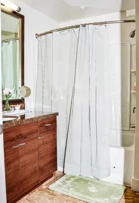 a bathroom with a shower curtain and a sink at MDR Studio Apartment Luxury pool, gym, parking, jacuzzi. in Los Angeles