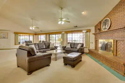 a living room with two couches and a fireplace at Spacious California Oasis Patio, Fireplace and Pool in Apple Valley