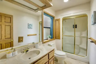 a bathroom with a sink and a shower and a toilet at Spacious California Oasis Patio, Fireplace and Pool in Apple Valley