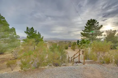 a trail in the desert with trees and bushes at Spacious California Oasis Patio, Fireplace and Pool in Apple Valley
