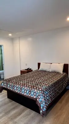 a bedroom with a large bed in a room at Budget inn Whittier in Whittier