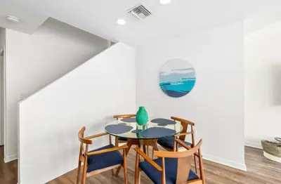a dining room with a table and chairs at Harbor Views Retreat By Venice Beach In Marina DR in Los Angeles