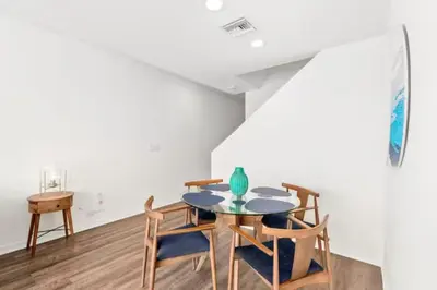 a dining room with a table and chairs at Harbor Views Retreat By Venice Beach In Marina DR in Los Angeles