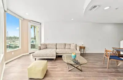 a living room with a couch and a table at Harbor Views Retreat By Venice Beach In Marina DR in Los Angeles