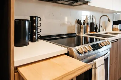 a kitchen with a stove and a counter top at Elegant Apartment in the Heart of Hollywood in Los Angeles