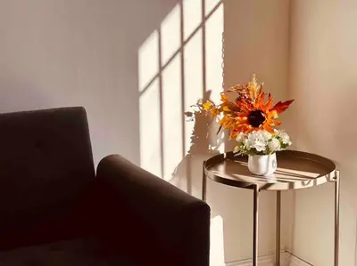 a vase of flowers sitting on a table in a room at Charming 3BR Retreat near Disneyland Downtown LA! in Rowland Heights