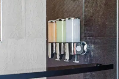a group of kitchen utensils hanging on a wall at Gamers Getaway by OC Adventure Homes in Stanton