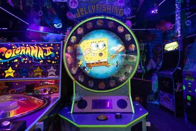 a hello kitty arcade game in a game room at Underwater Voyage by OC Adventure Homes in Garden Grove