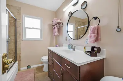a bathroom with a sink and a mirror at The Disneyland Dream by OC Adventure Homes in Garden Grove